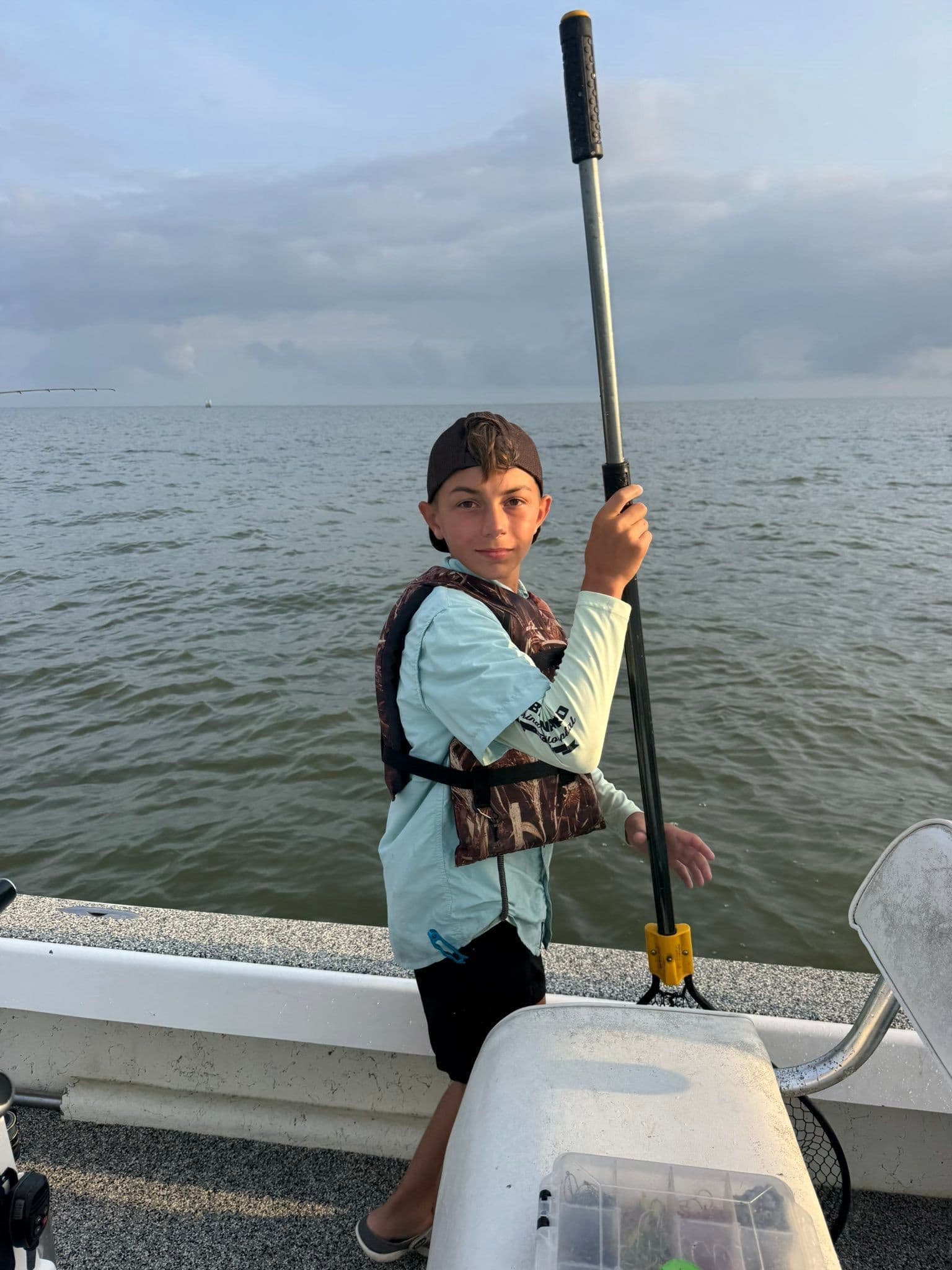 Future fishing enthusiast in the making! Enjoying a great day out on the water, ready for some Reel Excitement.